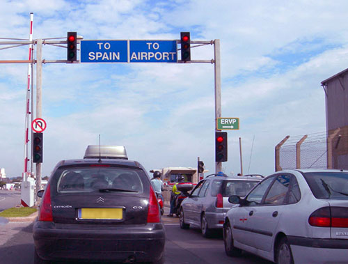 Road closed at Gibraltar Airport runway during aircraft operations Road closed at Gibraltar Airport runway during aircraft operations